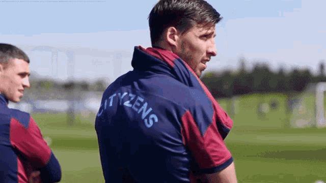 a man wearing a shirt that says citizens on it