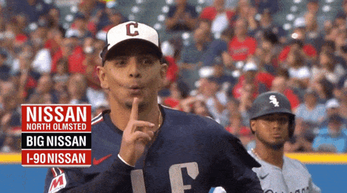 a baseball player wearing a nissan north olmsted big nissan i-90 nissan jersey