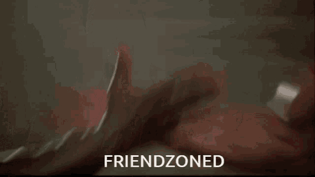 two men arm wrestling with the words friendzoned written above them
