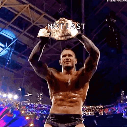 a shirtless wrestler is holding a wrestling championship belt with the caption " not last "