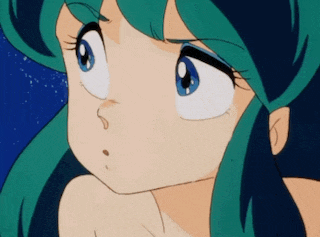 a close up of a girl 's face with green hair and blue eyes