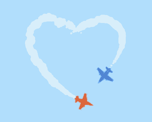 two airplanes are flying through a heart shaped cloud formation