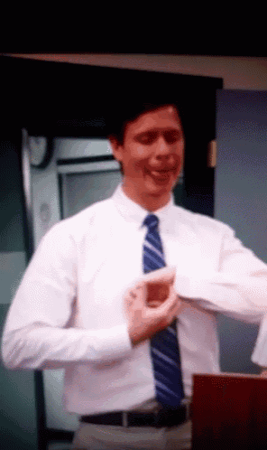 a man in a white shirt and blue tie