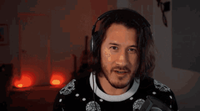 a blurry picture of a man 's face with headphones on