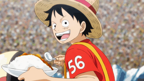 a boy with the number 56 on his shirt is holding a plate of rice