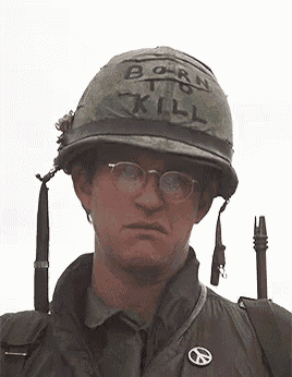 a man wearing a helmet with born to kill written on it