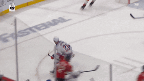 a hockey player with the number 21 on his jersey is skating on the ice