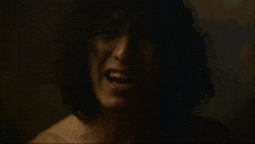 a close up of a person 's torso with a dark background .