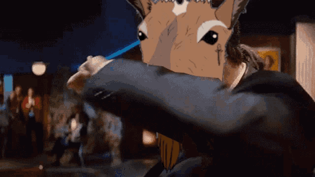 a man in a suit has a cartoon horse head on his head