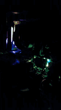a dark room with a blue light coming out of it