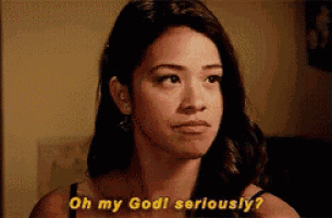 a woman is looking at the camera and saying `` oh my god seriously ? ''