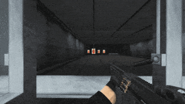 a person is holding a gun in front of a shooting range with red targets on the wall