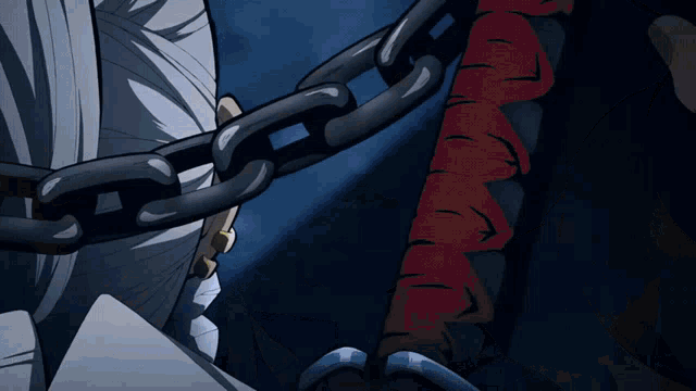 a person with a bandage on their arm is chained to another person 's arm