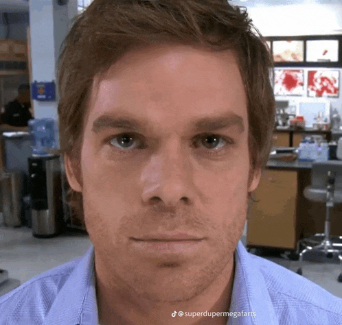 a close up of a man 's face with the hashtag superdupermegafarts on the bottom