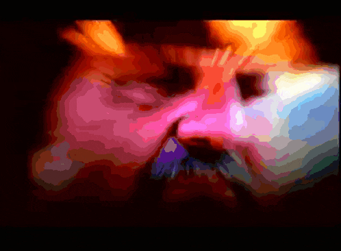 a close up of a person 's face with a rainbow of colors on it
