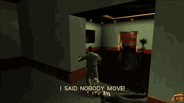 a man in a suit is walking through a hallway with the words i said nobody move above him