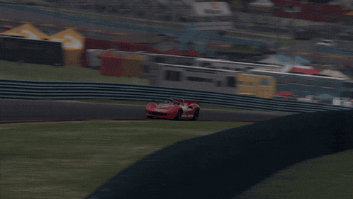 a red race car with the number 7 on the side