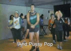 a group of people are dancing in a gym and the words and pussy pop are above them