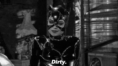 a black and white photo of a woman dressed as catwoman
