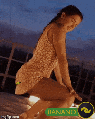 a woman is squatting down in front of a sign that says bananano