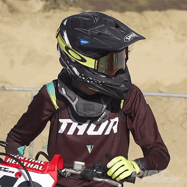 a person wearing a helmet and a shirt with thor on it