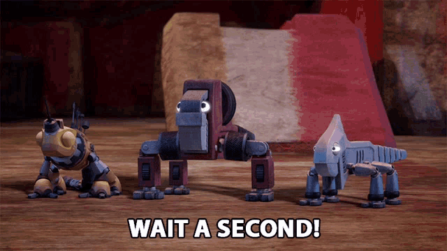 three robots are standing next to each other with the words wait a second on the bottom right