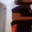 a blurry picture of a person standing in front of a building with a blurred background .