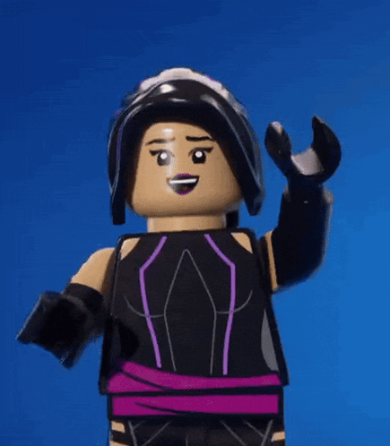 a lego figure is wearing a black and purple outfit and holding a wrench .