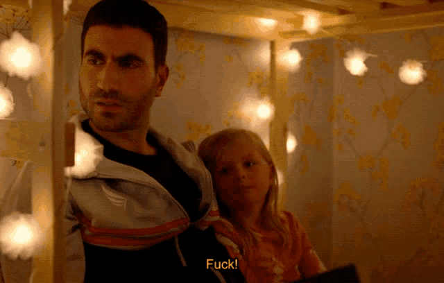 a man and a little girl are sitting under a bunk bed and the man says fuck