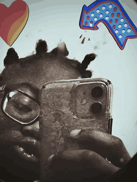 a person taking a picture of themselves with a phone