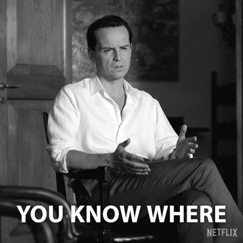 a black and white photo of a man sitting in a chair with the words " you know where " on the bottom