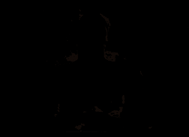 a shirtless man with a necklace around his neck