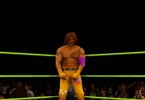 a wrestler with a tattoo on his chest is standing in the ring