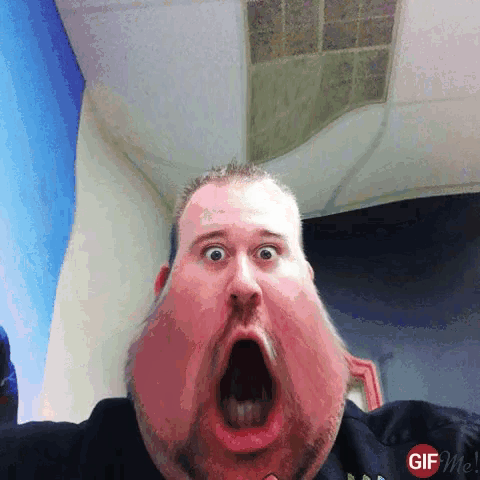 a gif of a man with a very large face