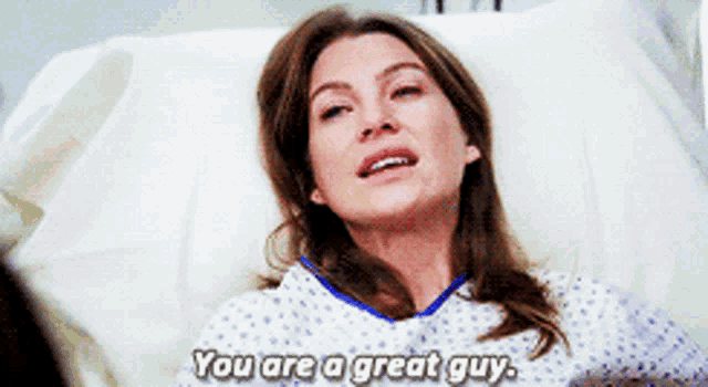 a woman is laying in a hospital bed and says you are a great guy