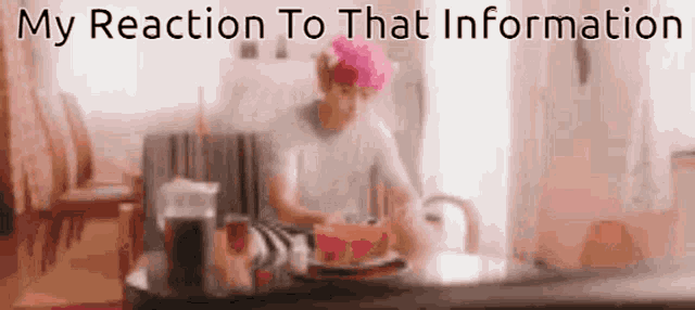 a blurred image of a woman sitting at a table with the words " my reaction to that information "