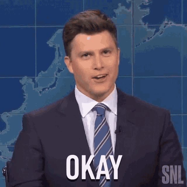 a man in a suit and tie says okay on snl