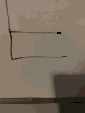 the letter l is drawn on a white board with a marker