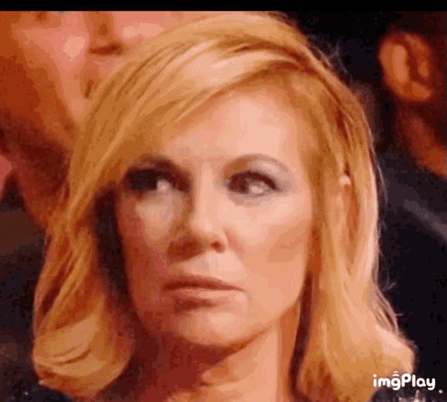 a close up of a woman 's face with the words imgplay visible in the corner