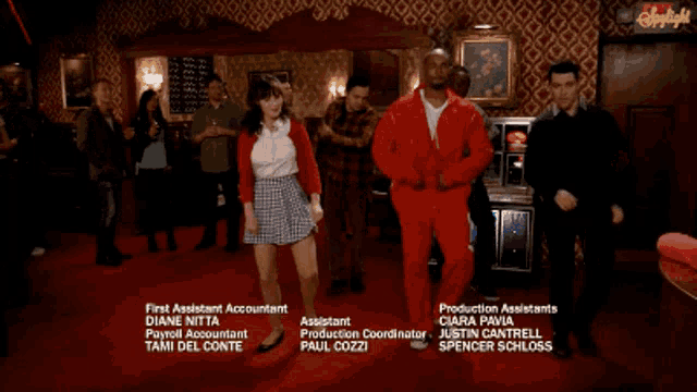 a group of people are dancing in a room with a sign that says daylight