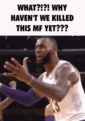 a basketball player is making a funny face while holding a basketball .