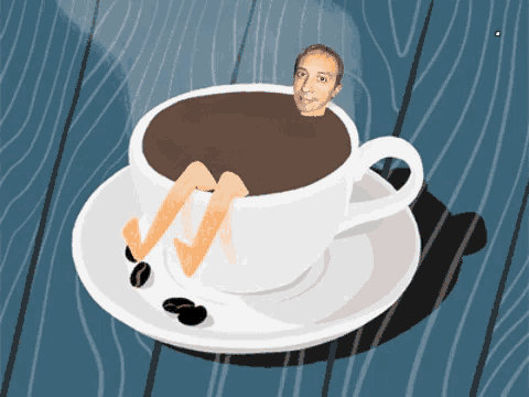 a man 's legs are sticking out of a coffee cup