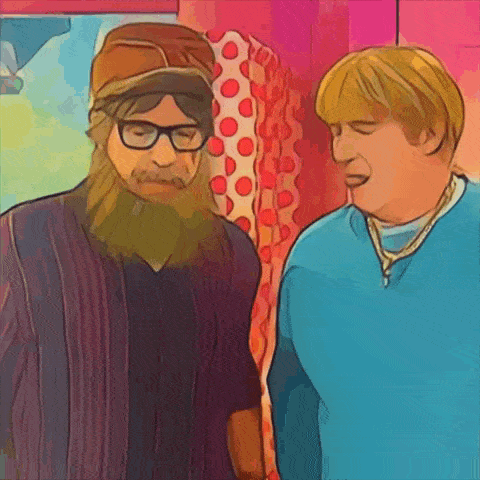 a man with a beard and glasses stands next to another man
