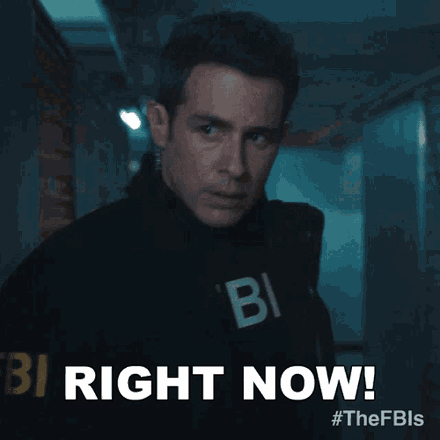 a man wearing a fbi vest says right now