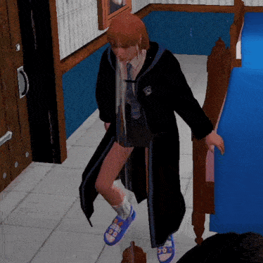 a girl in a harry potter outfit is standing next to a blue bed