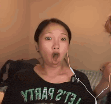 a woman wearing a shirt that says ytяa9 2't3