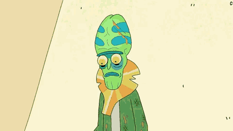 a cartoon character with a green head and blue eyes holds up his finger