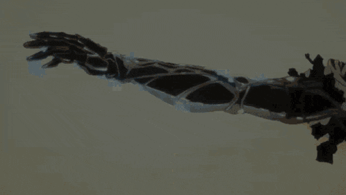 a close up of a person 's arm with a glove on .