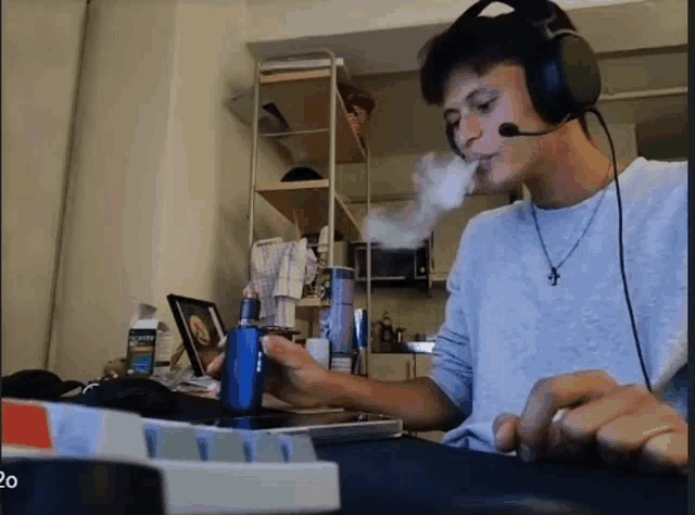 a man wearing headphones is smoking a cigarette
