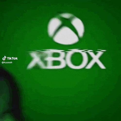a man in a green mask is standing in front of a green xbox logo